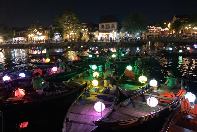 Image of Customers on traditional rowboat sightseeing Hoi An
